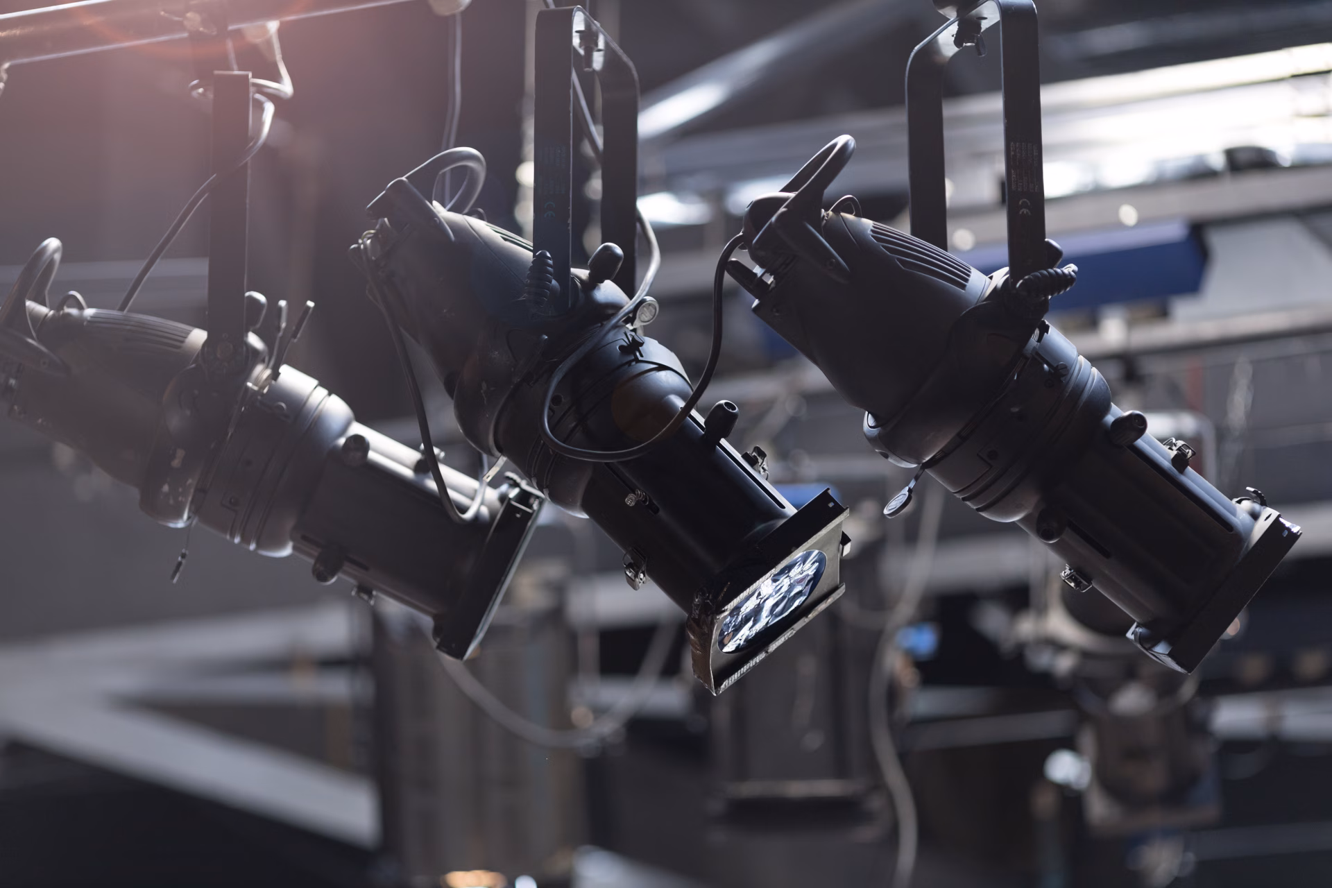 Stage lighting fixtures mounted on a lighting rig