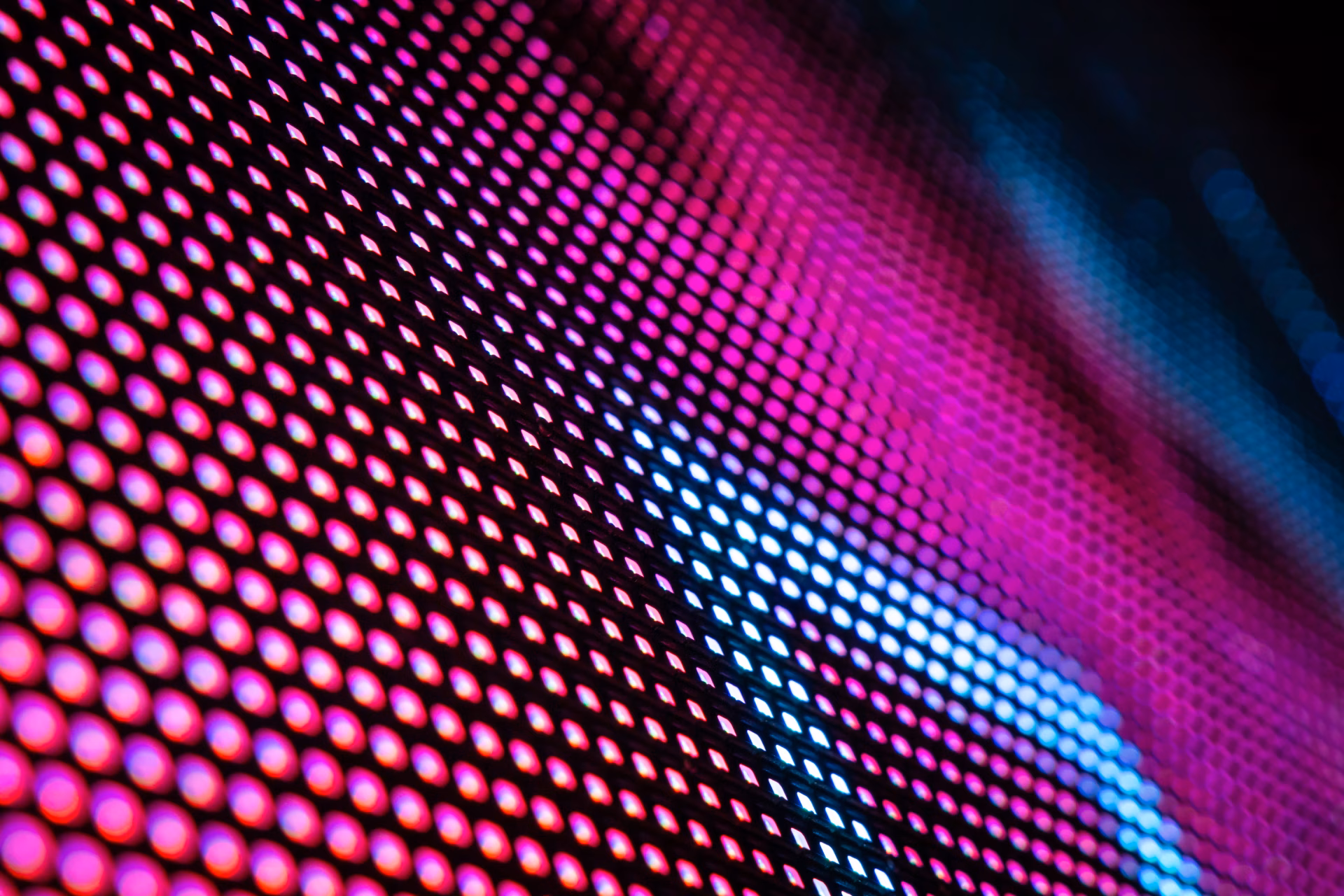 Close-up of an LED video wall showing pink and blue pixels