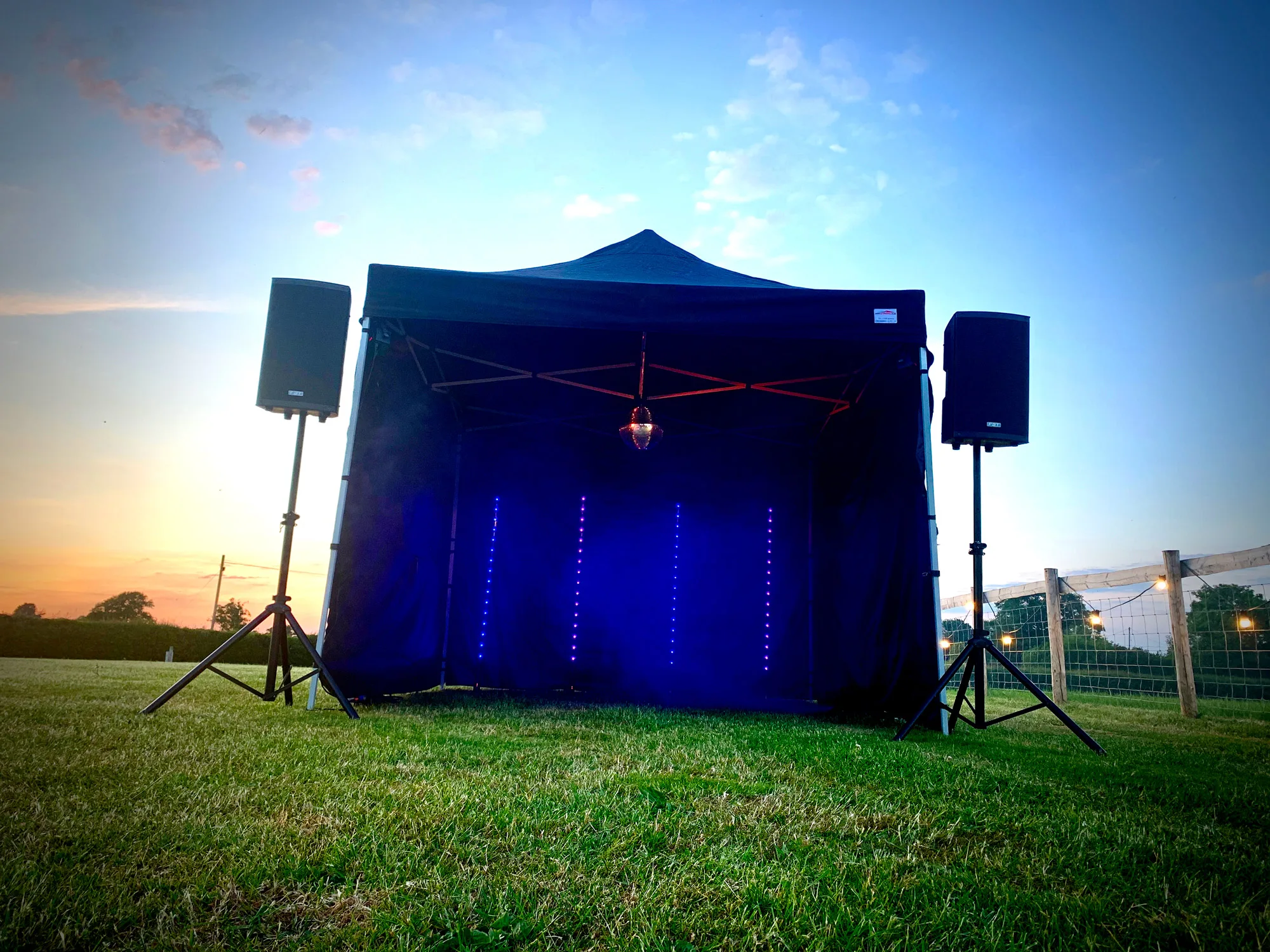 Gazebo on lawn with PA system, Disco Ball and lighting