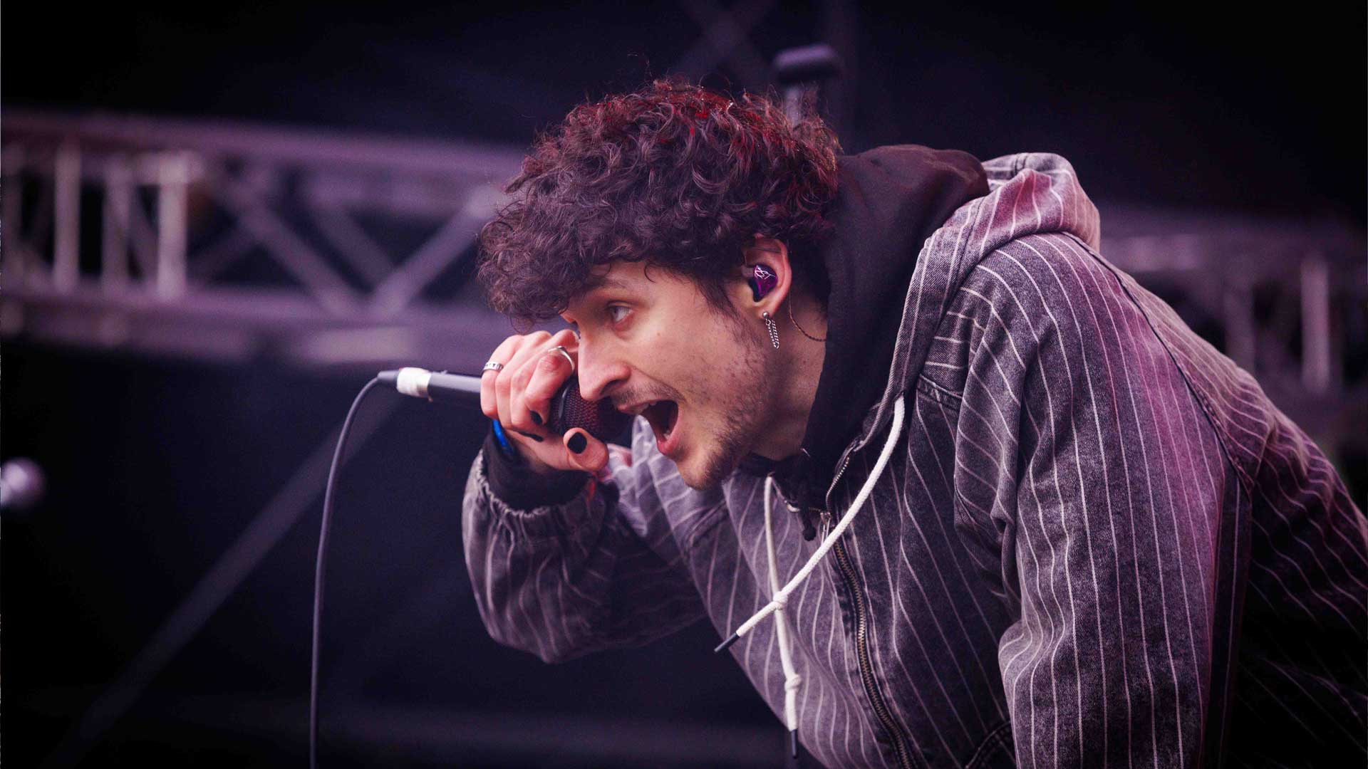 IEM System for Performer singing on stage with microphone in hand
