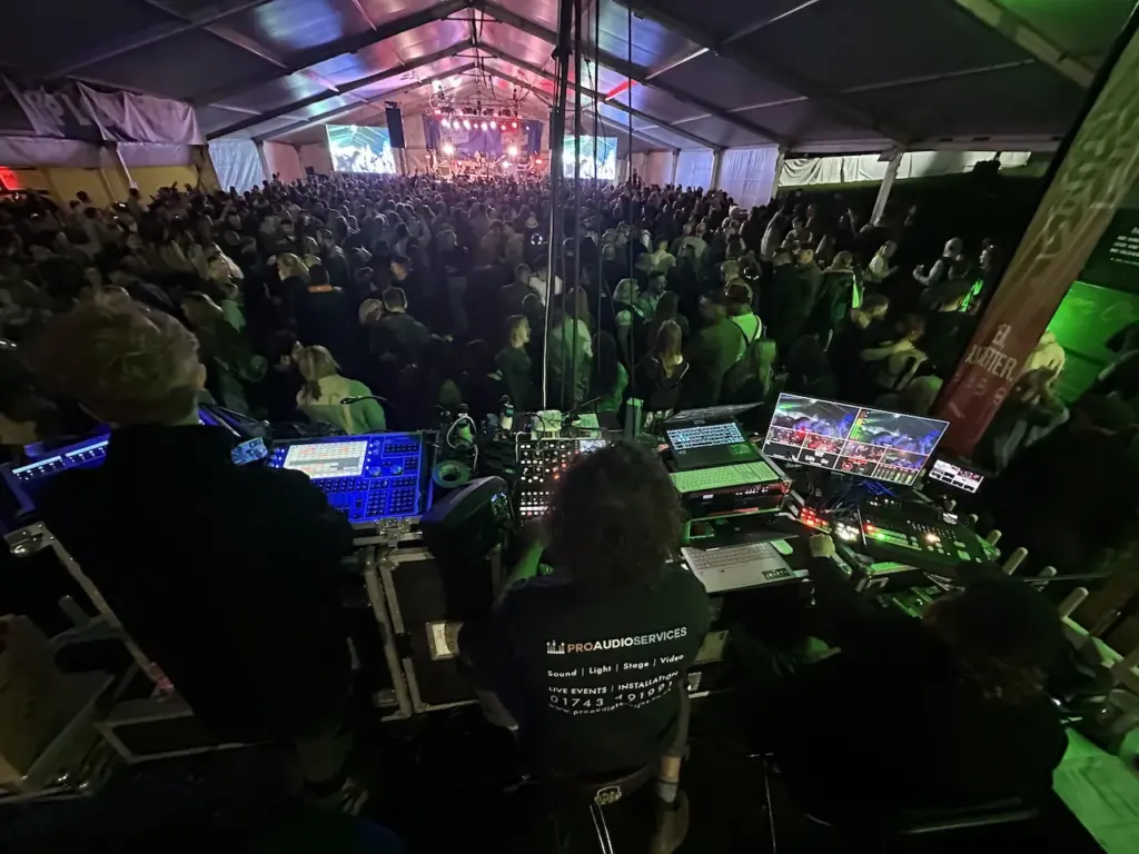 View from the mixing desk across a packed marquee crowd at Oktoberfest