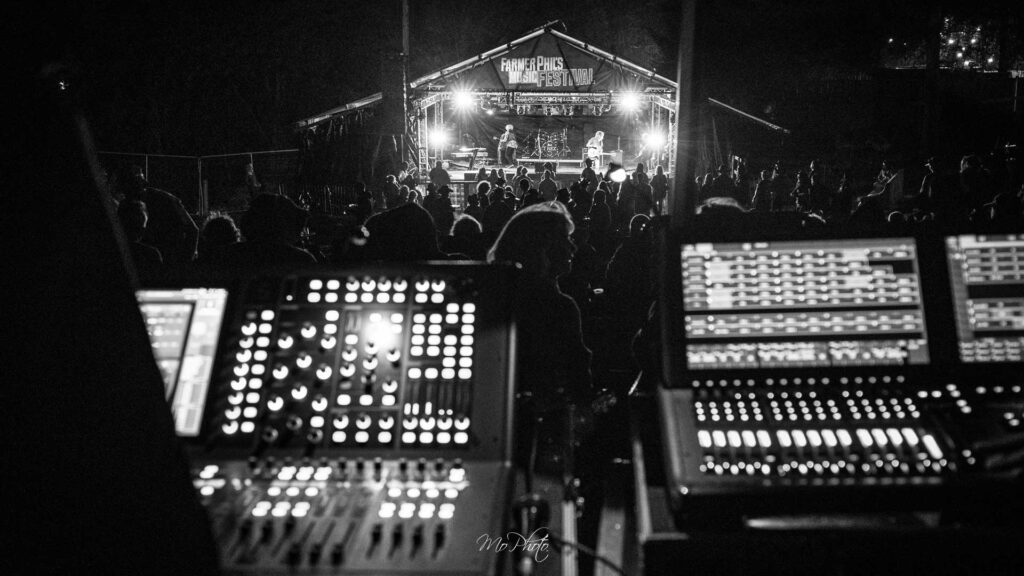 Looking over the sound and lighting consoles from front of house mixing position at Farmer Phil's Festival 2025