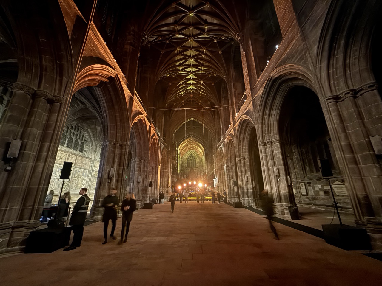Chester cathedral set-up with stage at one end and speakers set-up along the length