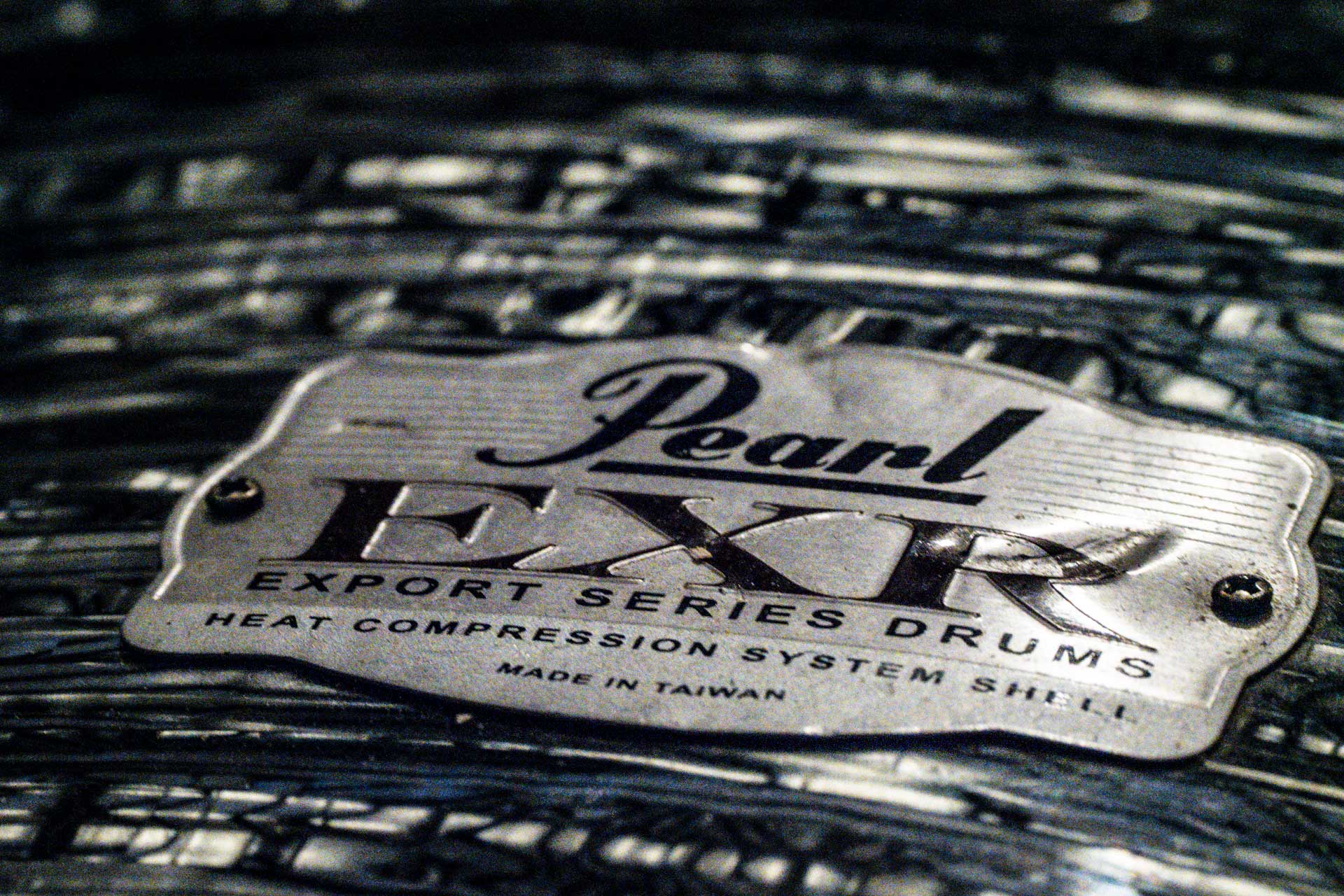 Close up of Pearl Drum Kit shell showing logo and EXR range