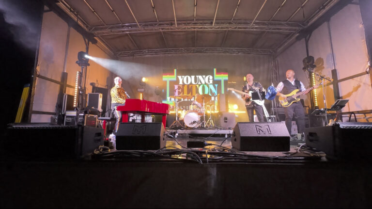 Band playing on stage at Ashfest 2026, the community day festival for The White Lion pub, with PA hire from Pro Audio Services